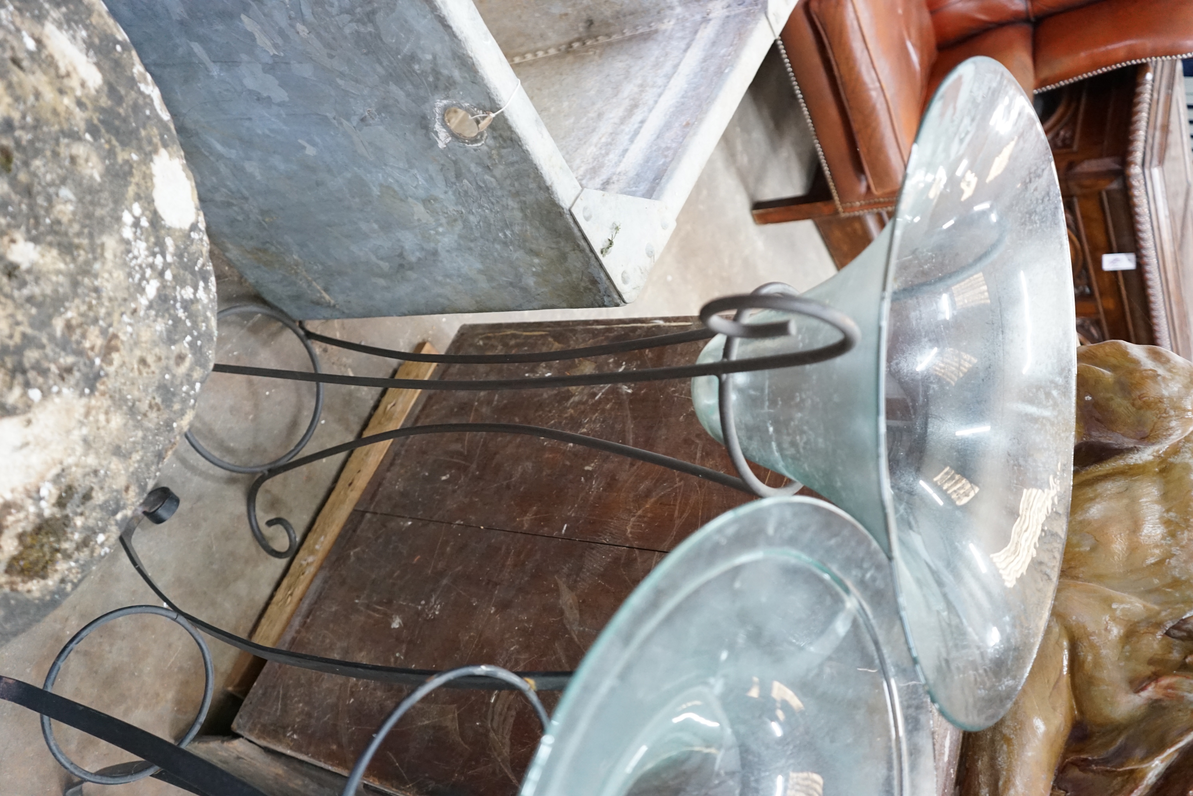 A near pair of circular glass bowls on wrought iron stands, tallest 103cm